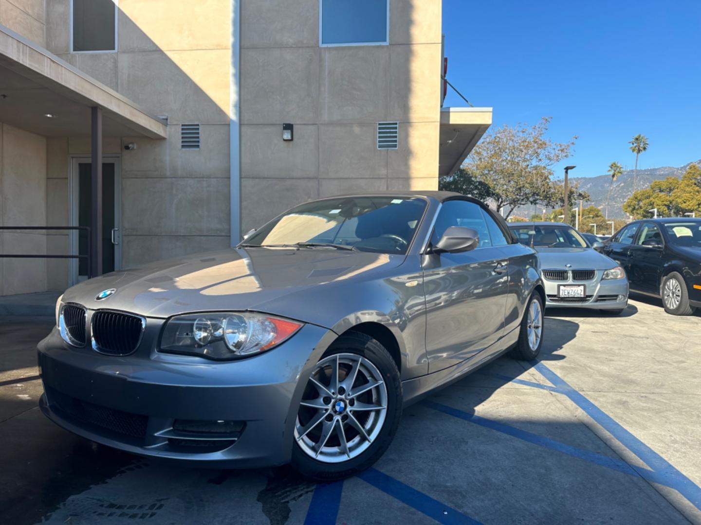 2011 Gray /Black BMW 1-Series 128i Convertible (WBAUN1C52BV) with an 3.0L L6 DOHC 24V engine, Automatic transmission, located at 30 S. Berkeley Avenue, Pasadena, CA, 91107, (626) 248-7567, 34.145447, -118.109398 - Low Miles!!! Elevate your driving experience with our 2011 BMW 1-Series 128i Convertible, now featured at our Buy Here Pay Here (BHPH) dealership in Pasadena, CA. Ideal for enthusiasts in Altadena CA, Glendale CA, Los Angeles CA, and throughout LA County, this stunning pre-owned convertible combine - Photo#0